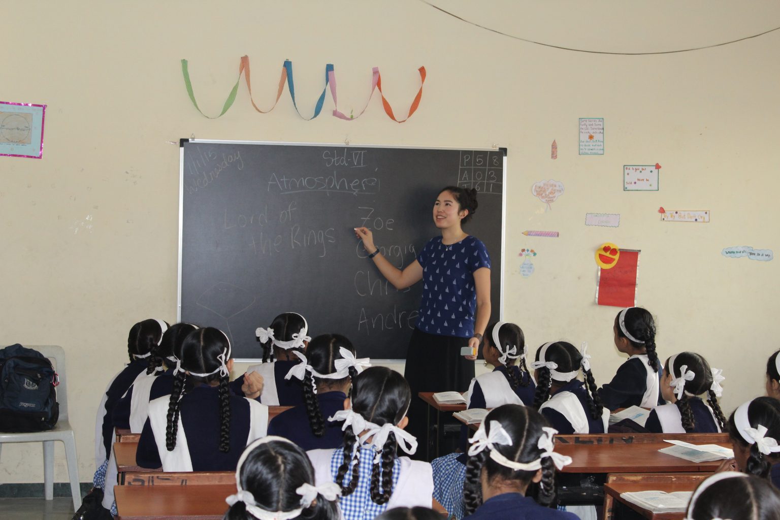 Student leading a classroom of students in a lesson