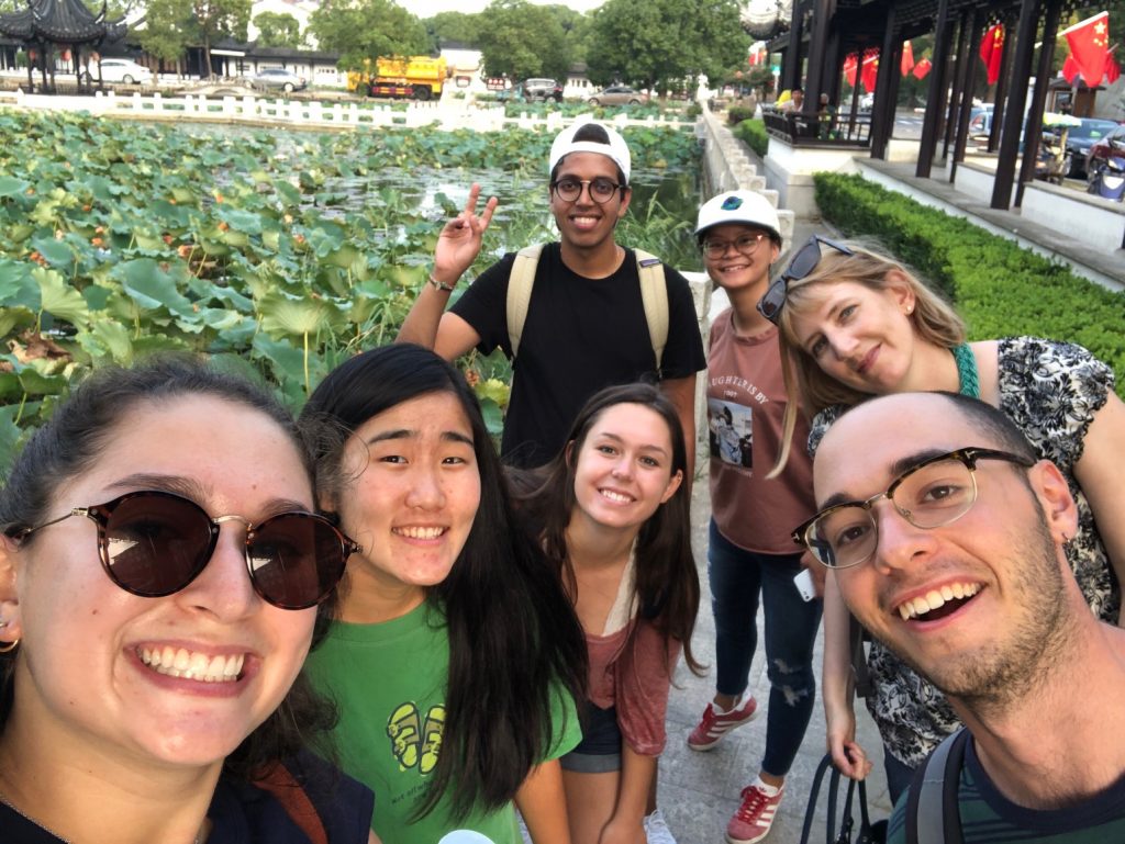 Students and Prof. Dana Hunt posing by Chinese pond
